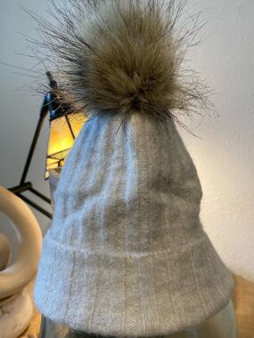 AUXILIARY Soft 
Light Grey Beanie with Tan Pom-Pom